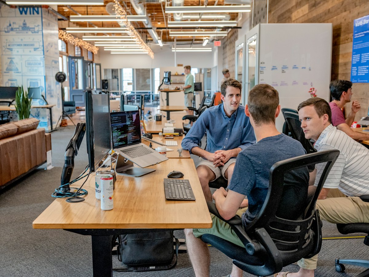 CoreTech delivery team collaborating in an open office
